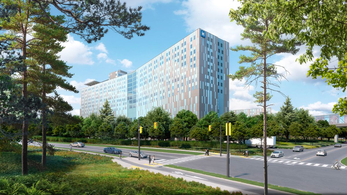 An artist rendering of The Ottawa Hospital’s new campus during the day, showing the left side of the exterior of the hospital. Trees in the foreground on the left and right sides frame the hospital in the centre. A road with vehicles on it runs left to right in front of the hospital, leading to an intersection with traffic lights at lower right.