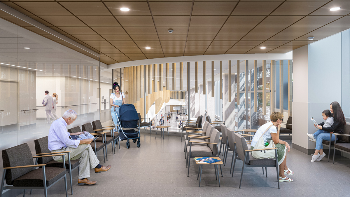 An artist rendering of the interior of a waiting room at The Ottawa Hospital’s new campus. A few people are seated at various locations, and a woman is entering the room pushing a baby stroller. Two of the walls of the room are glass; the one on the left shows the hallway outside the room while the background wall shows the main floor concourse of the hospital below.